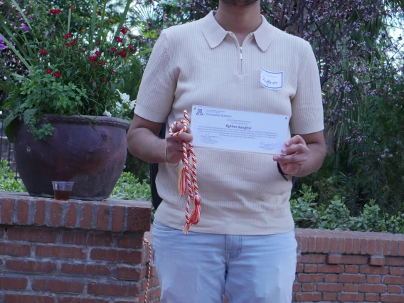Rhythm displaying his certificate