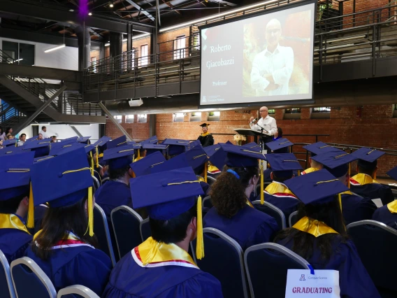 Roberto speaking at 2025 may grad as keynote