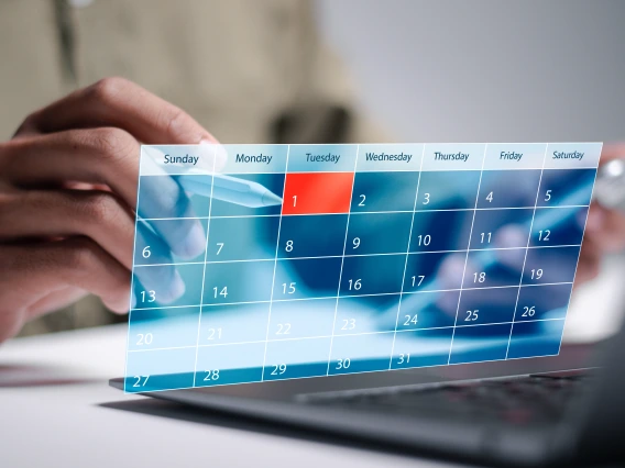 digital calendar displayed from back being clicked on by a stylus
