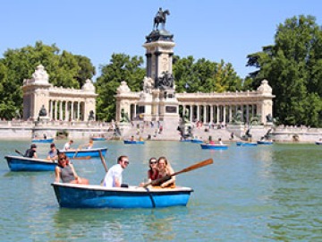 four people in a rowboat in Madrid, Spain